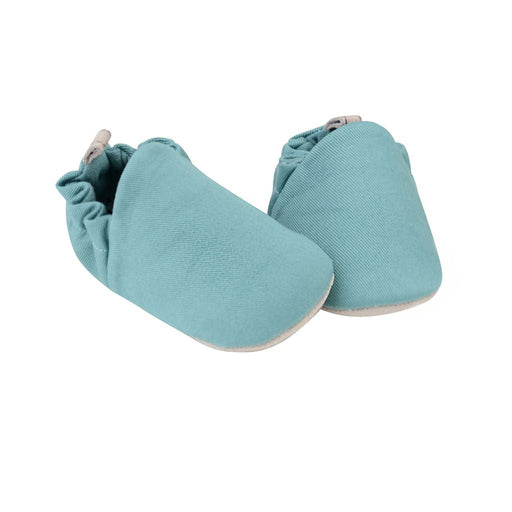 A Blue Slip Ons from Poco Nido in size 3-6M for neutral. (Front View)