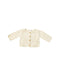 A Beige Cardigans from Bonpoint in size 0-3M for girl. (Front View)