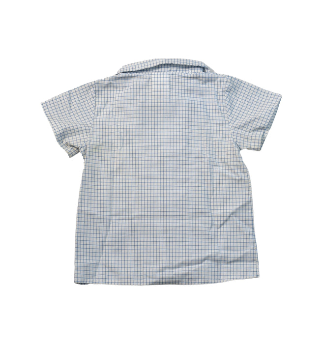 A White Shirts from Dona Carmen in size 6-12M for girl. (Back View)