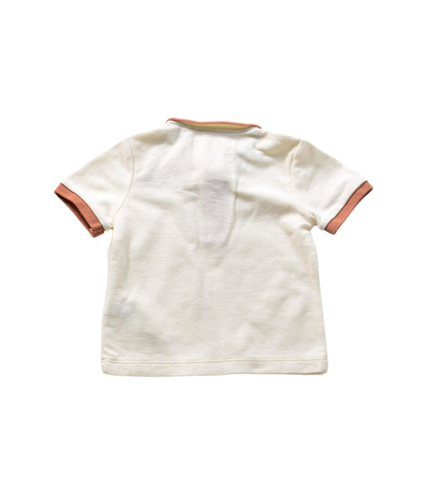A White Short Sleeve Polos from Gingersnaps in size 3-6M for boy. (Back View)