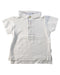 A White Short Sleeve Polos from Laranjinha in size 3-6M for boy. (Front View)