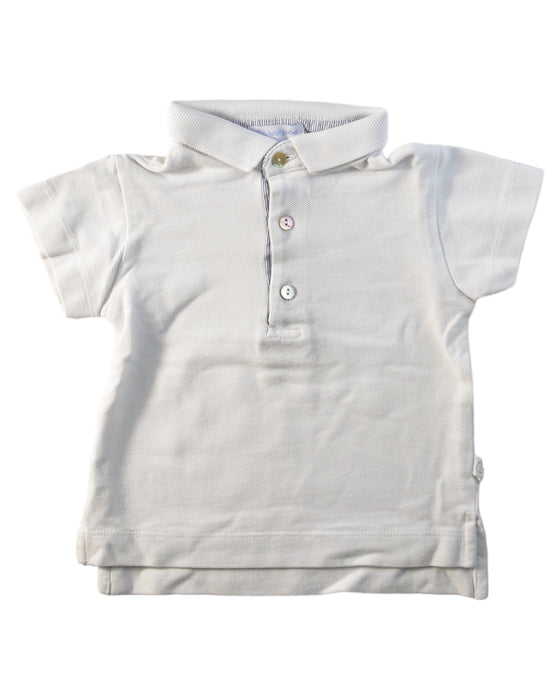 A White Short Sleeve Polos from Laranjinha in size 3-6M for boy. (Front View)