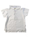 A White Short Sleeve Polos from Laranjinha in size 3-6M for boy. (Front View)