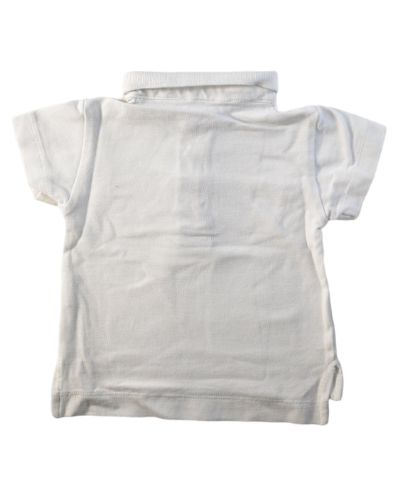 A White Short Sleeve Polos from Laranjinha in size 3-6M for boy. (Back View)