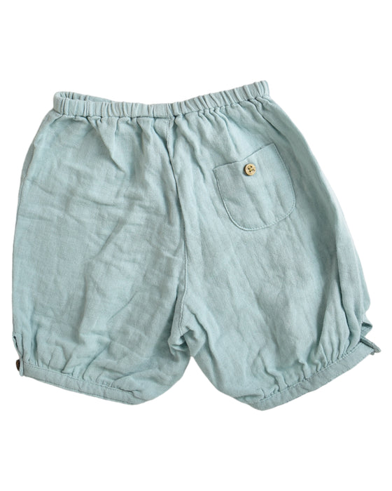 A Green Shorts from Chateau de Sable in size 6-12M for neutral. (Back View)