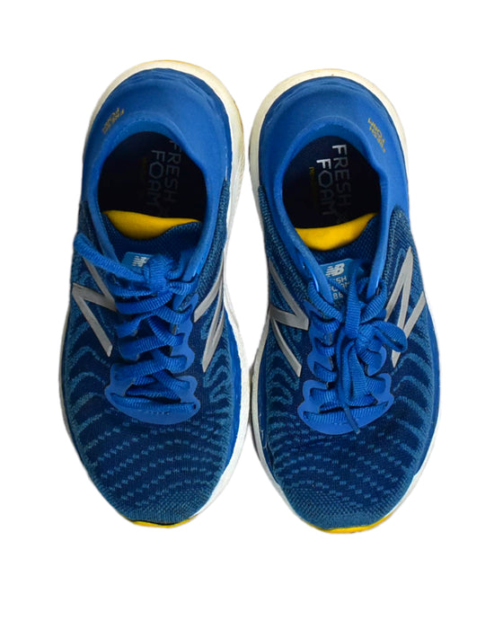 A Blue Sneakers from New Balance in size 6T for boy. (Back View)