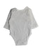 A White Bodysuits from Purebaby in size Newborn for neutral. (Back View)