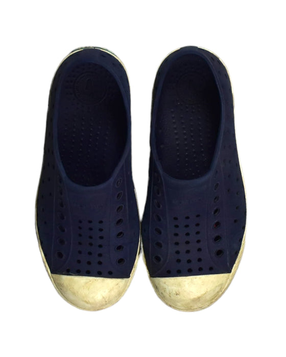 A Blue Slip Ons from Native Shoes in size 6T for boy. (Back View)