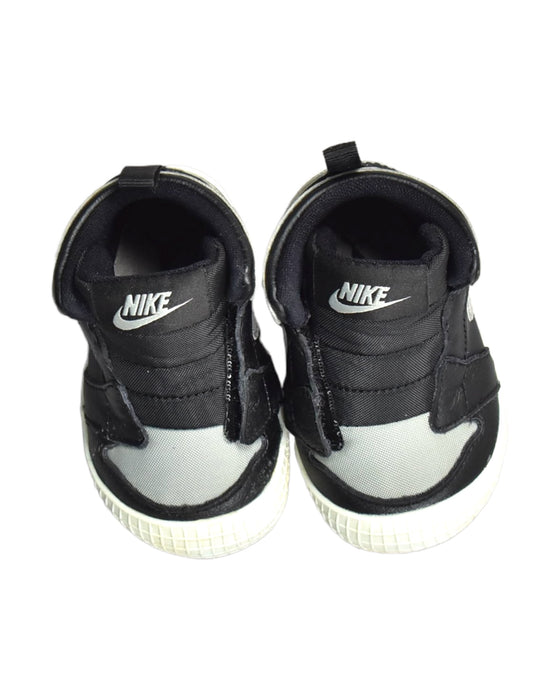 A Black Sneakers from Nike in size 12-18M for boy. (Back View)