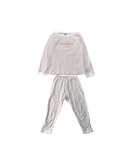 A Ivory Pyjama Sets from Petit Bateau in size 4T for girl. (Front View)