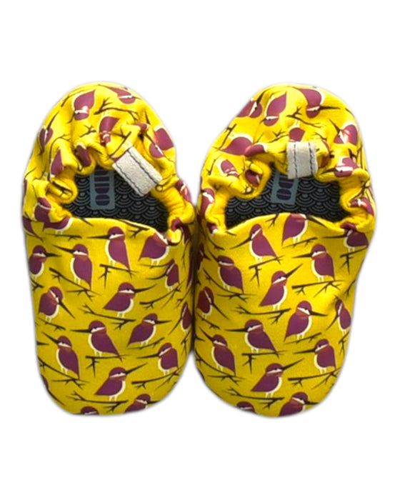 A Yellow Booties from Poco Nido in size 18-24M for neutral. (Back View)
