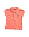 A Peach Short Sleeve Polos from Ralph Lauren in size 2T for girl. (Front View)
