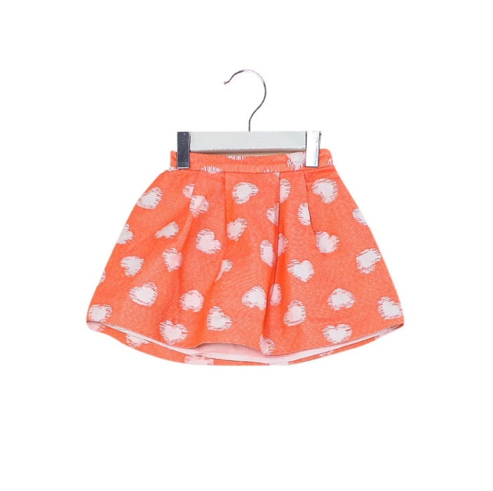 A Orange Short Skirts from Bonpoint in size 4T for girl. (Front View)