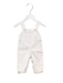 A White Long Overalls from Ovale in size 3-6M for girl. (Front View)