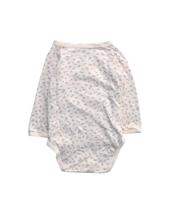 A Ivory Long Sleeve Bodysuits from Petit Bateau in size 6-12M for girl. (Back View)