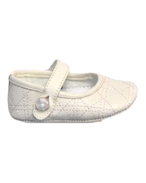A Ivory Flats from Dior in size Newborn for girl. (Front View)
