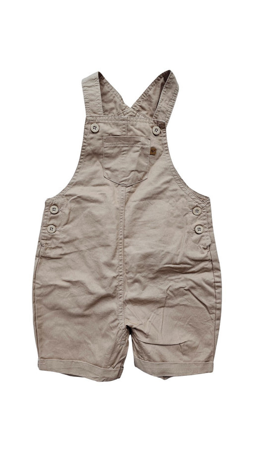 A Beige Overall Shorts from Sprout in size 6-12M for neutral. (Front View)