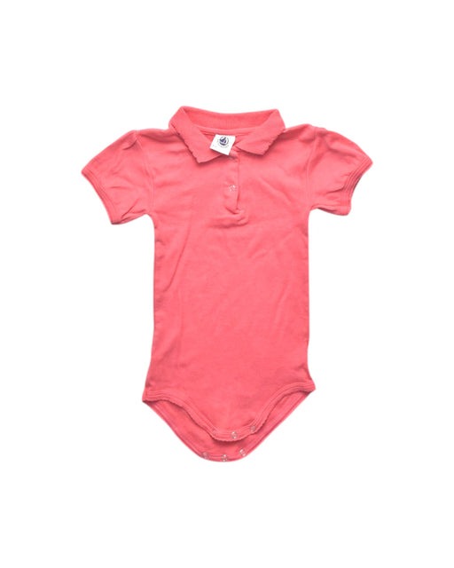 A Pink Short Sleeve Bodysuits from Petit Bateau in size 12-18M for girl. (Front View)