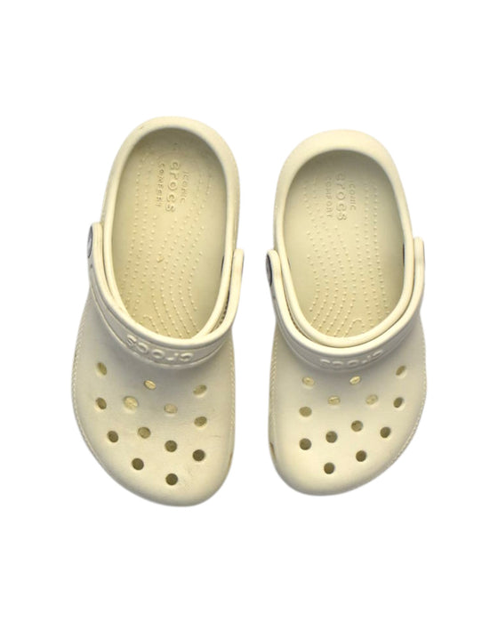 A Beige Slip Ons from Crocs in size 5T for boy. (Back View)