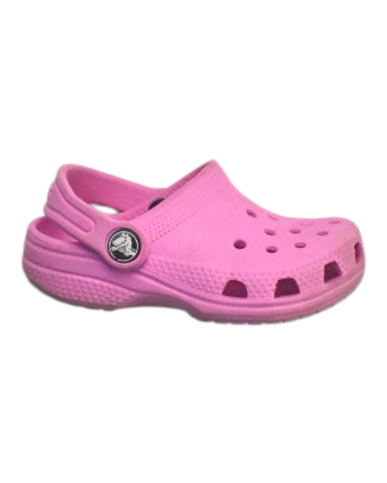 A Pink Slip Ons from Crocs in size 18-24M for girl. (Front View)