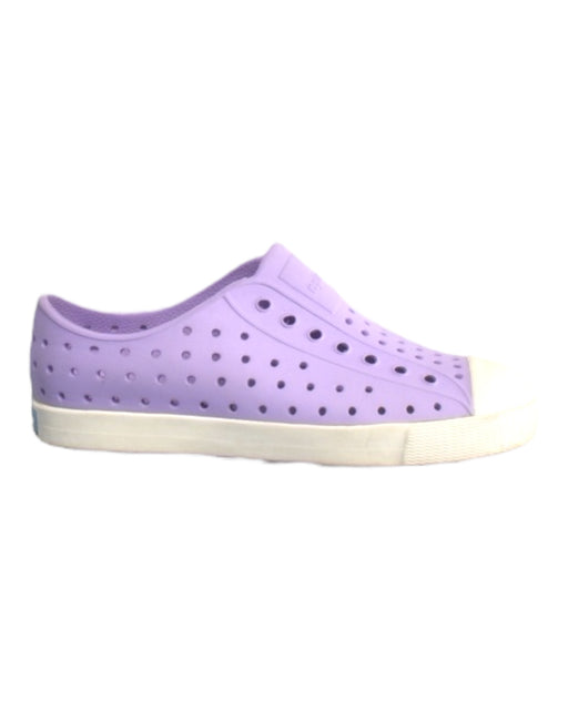 A Purple Slip Ons from Native Shoes in size 7Y for girl. (Front View)