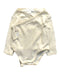 A Ivory Long Sleeve Bodysuits from Purebaby in size Newborn for girl. (Front View)