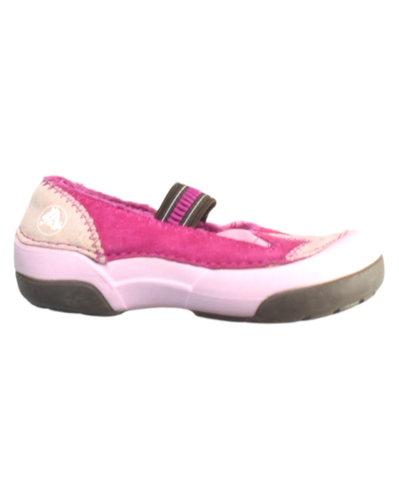 A Pink Flats from Crocs in size 4T for girl. (Front View)