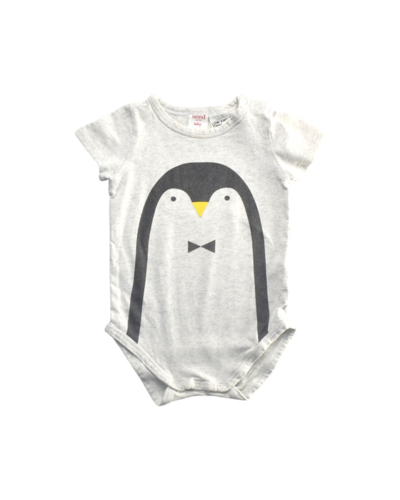 A White Short Sleeve Bodysuits from Seed in size 3-6M for girl. (Front View)