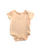 A Peach Short Sleeve Bodysuits from Mothercare in size 0-3M for girl. (Front View)