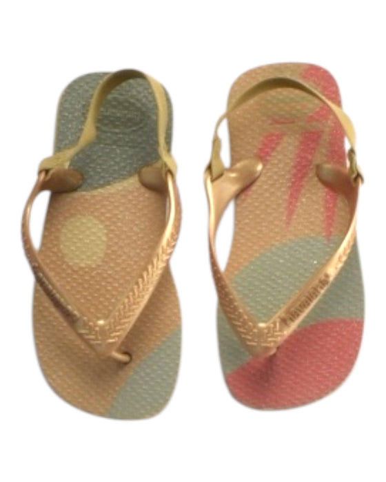 A Gold Flip Flops from Havaianas in size 4T for girl. (Back View)