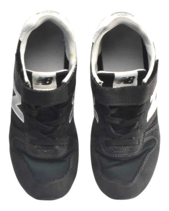 A Black Sneakers from New Balance in size 10Y for boy. (Back View)