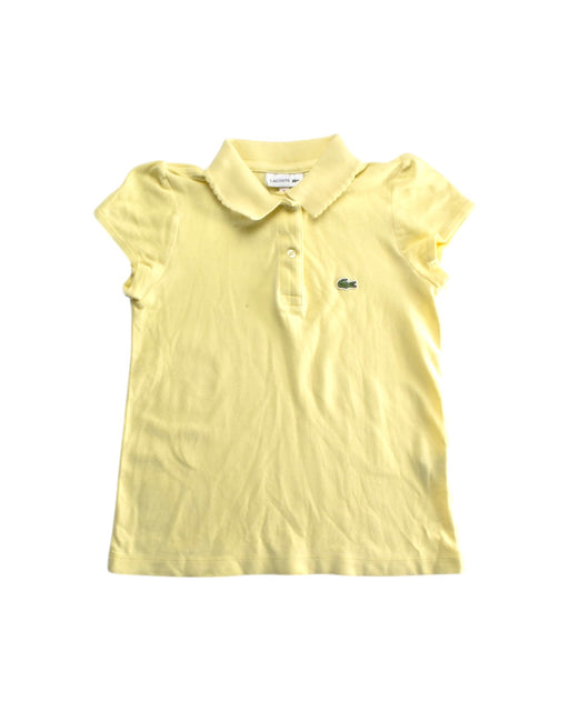 A Yellow Short Sleeve Polos from Lacoste in size 6T for girl. (Front View)