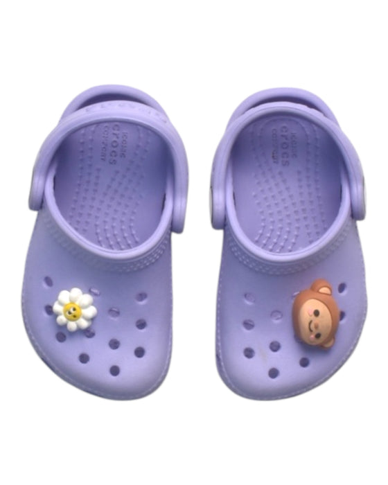 A Purple Slip Ons from Crocs in size 12-18M for girl. (Back View)