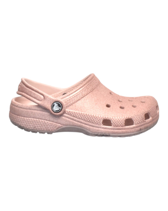 A Pink Slip Ons from Crocs in size 6T for girl. (Front View)