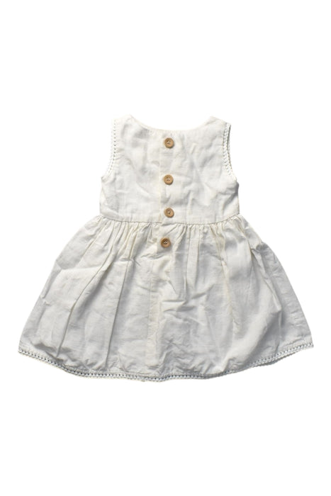 A Ivory Sleeveless Dresses from Our Mini Nature in size 12-18M for girl. (Front View)