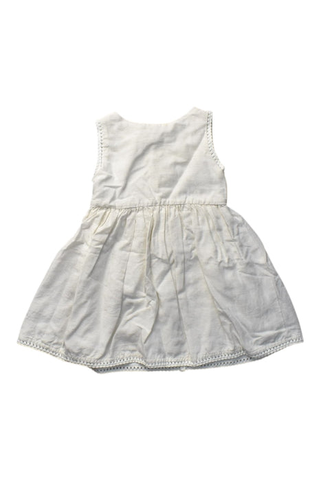 A Ivory Sleeveless Dresses from Our Mini Nature in size 12-18M for girl. (Back View)