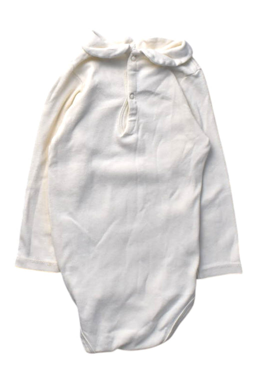 A White Long Sleeve Bodysuits from Petit Bateau in size 12-18M for girl. (Front View)
