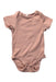 A Pink Short Sleeve Bodysuits from Mori in size Newborn for girl. (Front View)
