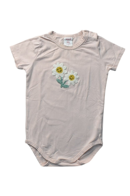 A Peach Short Sleeve Bodysuits from Seed in size 6-12M for girl. (Front View)