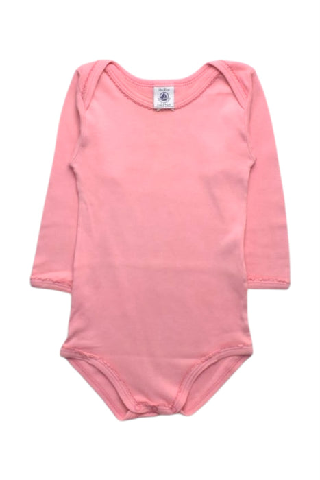 A Pink Long Sleeve Bodysuits from Petit Bateau in size 12-18M for girl. (Front View)