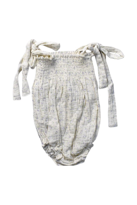 A Ivory Sleeveless Rompers from Nothing Fits But in size 12-18M for girl. (Front View)
