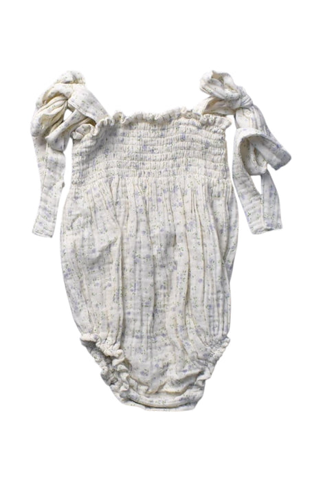 A Ivory Sleeveless Rompers from Nothing Fits But in size 3-6M for girl. (Back View)