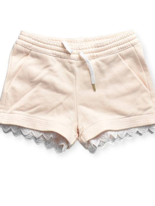 A Peach Shorts from Chloe in size 4T for girl. (Front View)