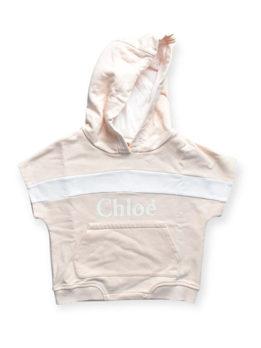 A Peach Hooded Sweatshirts from Chloe in size 4T for girl. (Front View)