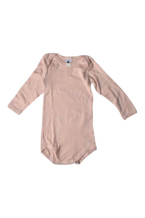 A Peach Long Sleeve Bodysuits from Petit Bateau in size 6-12M for girl. (Front View)