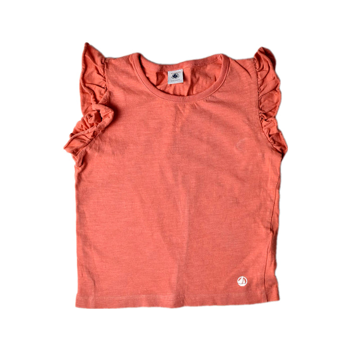A Peach Sleeveless Tops from Petit Bateau in size 6T for girl. (Front View)