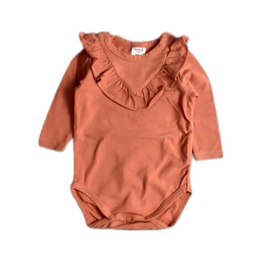 A Orange Long Sleeve Bodysuits from Seed in size 0-3M for girl. (Front View)