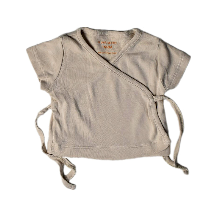 A Beige Short Sleeve Tops from Le Petit Society in size 0-3M for neutral. (Front View)
