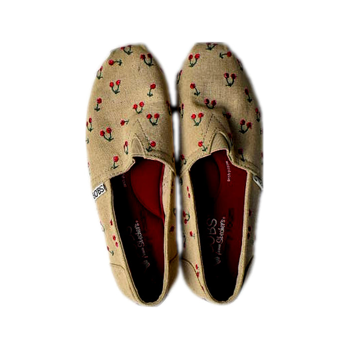 A Beige Slip Ons from Skechers in size 12Y for girl. (Back View)
