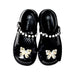 A Black Flats from Taranis in size 4T for girl. (Back View)